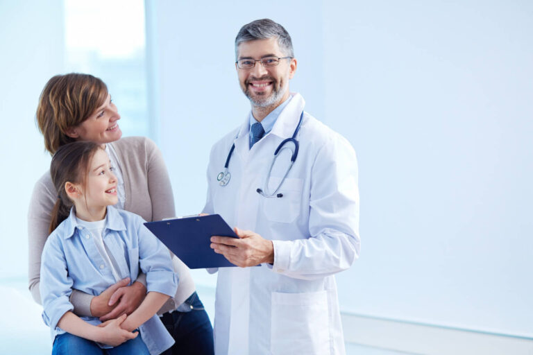 A doctor consulting with a patient and her child
