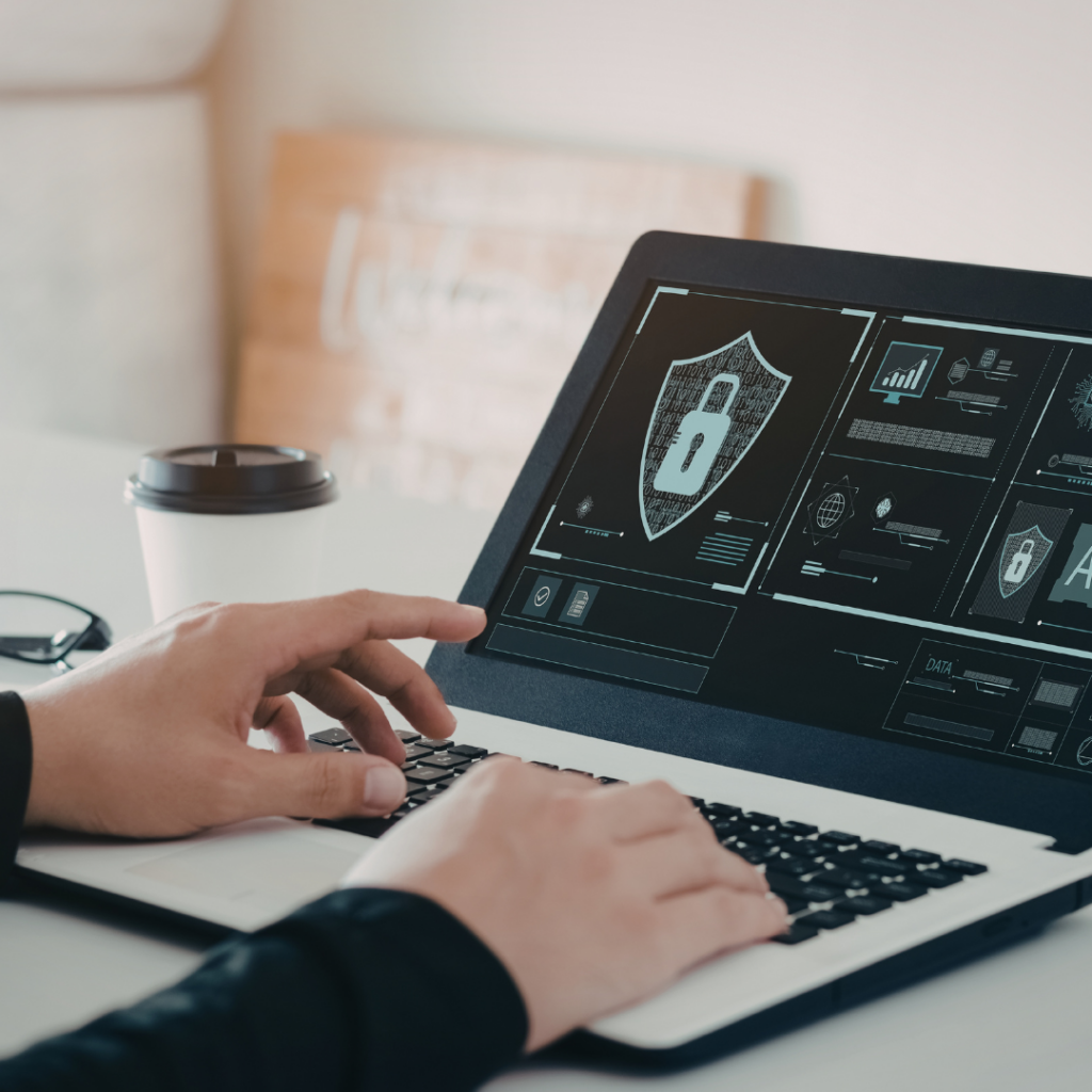 The Cybersecurity Risk Most Small Businesses Overlook 1 Small business owner working on their cybersecurity,