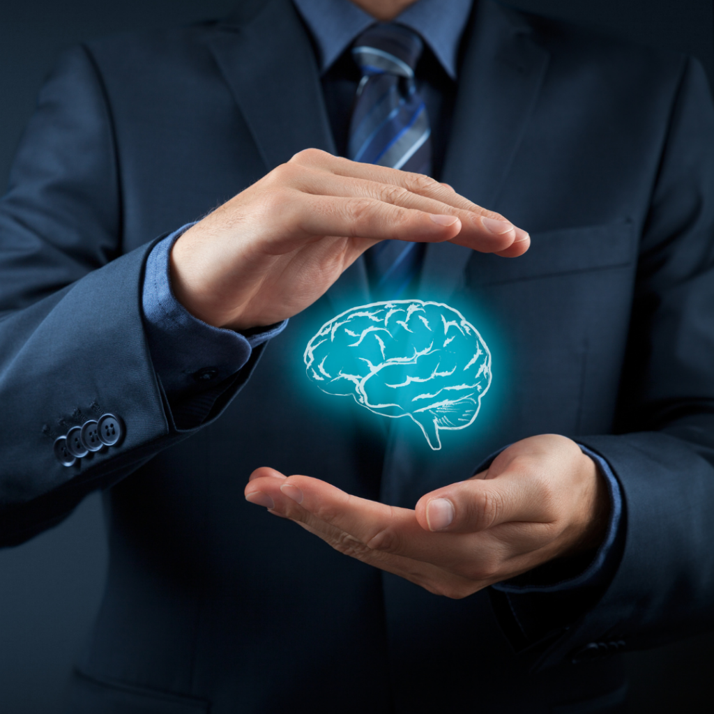 How to Create an AI Policy for Your Business 1 Person holding an an AI brain in their hands representing protection of intellectual property.